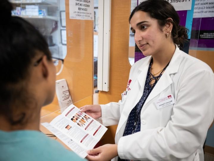 Pharmacists consulting with a patient